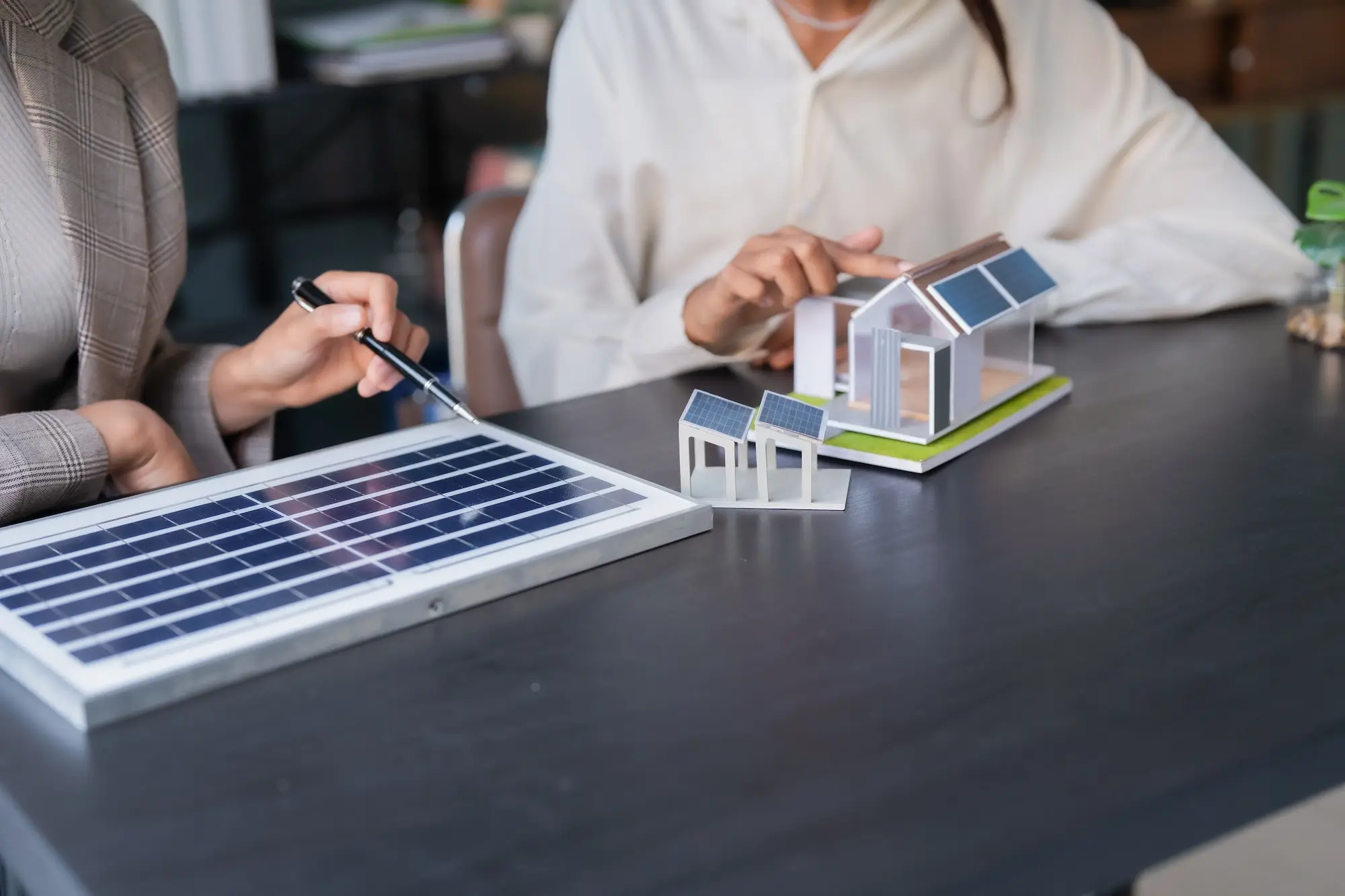 Solar Inspection for Home Buyers & Sellers Homeowner reviewing solar system performance report during a real estate transaction