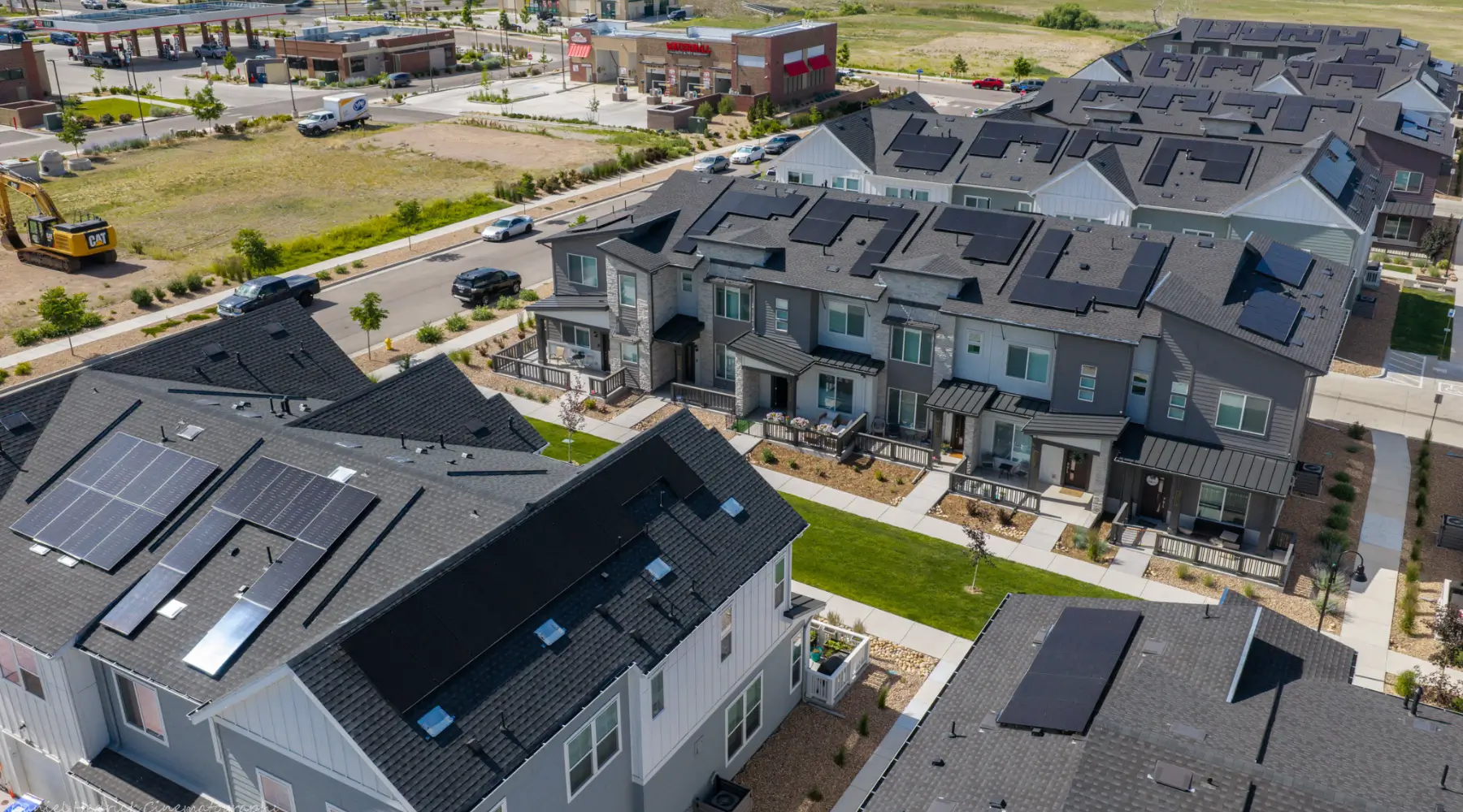 Aerial view of the 1671 Altura solar project showing rooftop arrays across the development