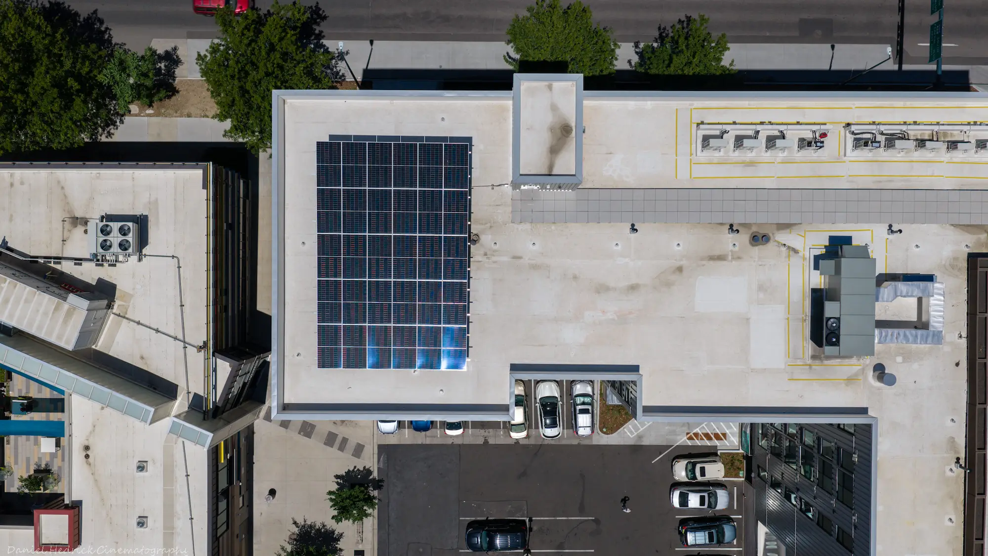 The Irving rooftop solar array with the Denver skyline in the background