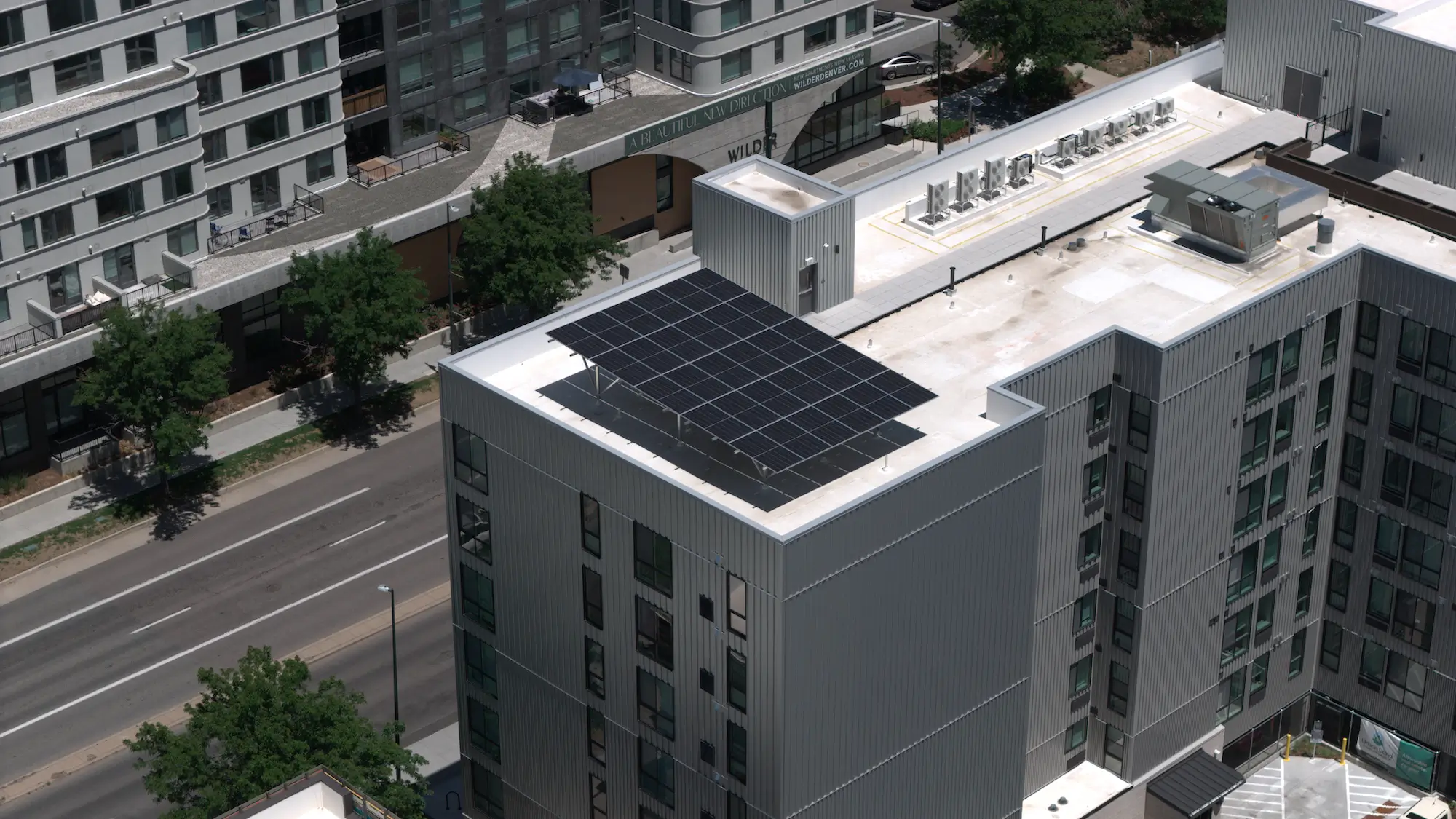 Universal Renewables elevated racking system supporting solar panels at The Irving
