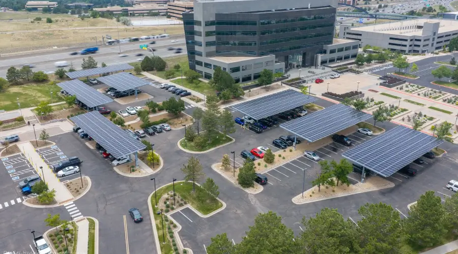 Solar parking canopies installed throughout the 169 Inverness parking lot in Englewood