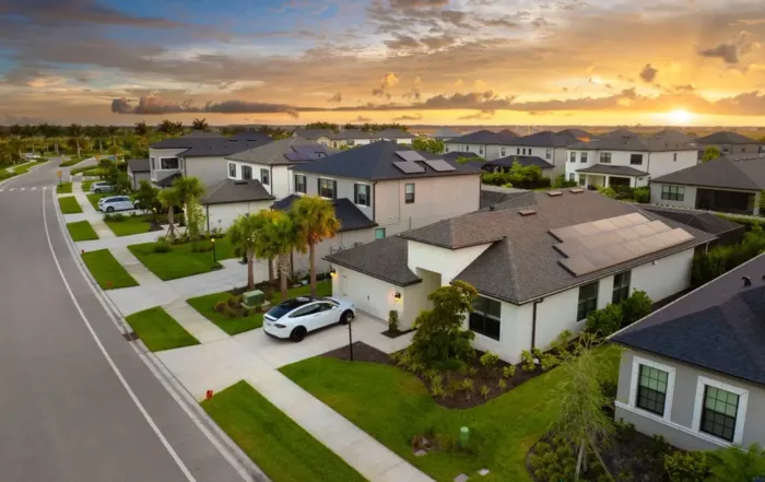 Residential neighborhood with rooftop solar panels illustrating the cost to remove and reinstall solar panels