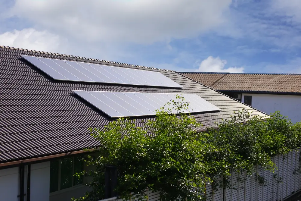 Residential rooftop solar panels installed on a home after detach and reset service