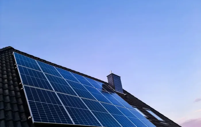 Solar panels installed on a residential roof before removal for roof replacement